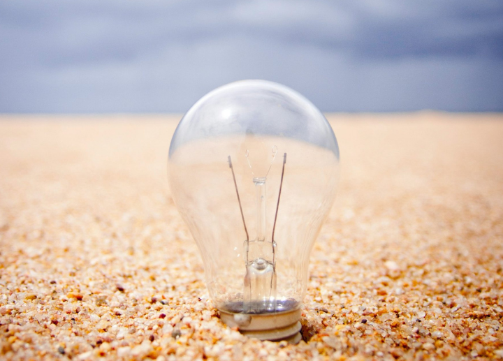 image of lightbulb in sand